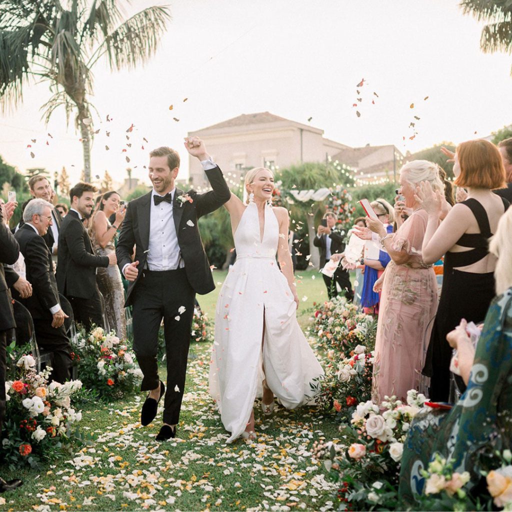 Romantic wedding in Sicily couple kissing during sunset ceremony